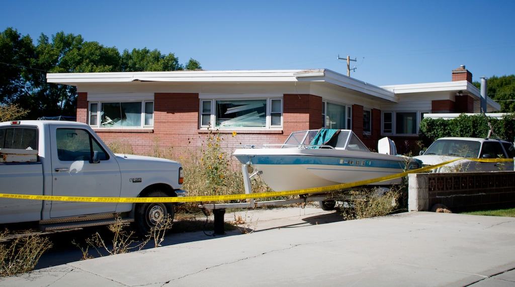 (Bethany Baker  |  The Salt Lake Tribune) Broken windows are seen at the scene where two law enforcement officers were killed after responding to a domestic disturbance call in Tremonton, Monday, Aug. 18, 2025.