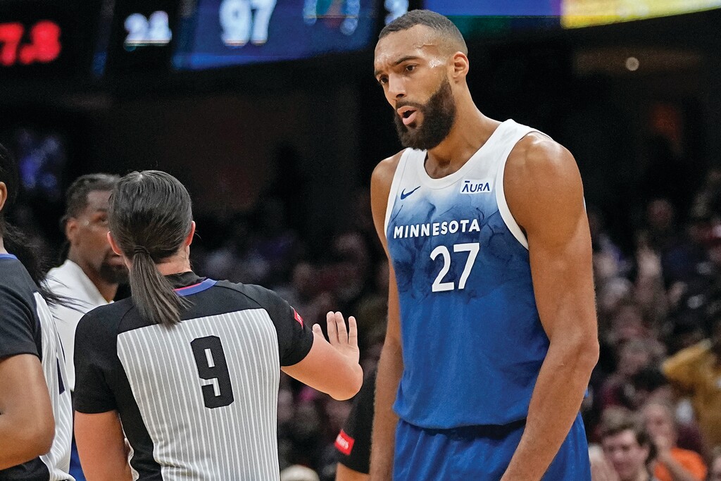 (Sue Ogrocki | AP) Minnesota Timberwolves center Rudy Gobert (27) talks with referee Natalie Sago (9) after being called for a technical foul in the second half of an NBA basketball game against the Cleveland Cavaliers, Friday, March 8, 2024, in Cleveland.