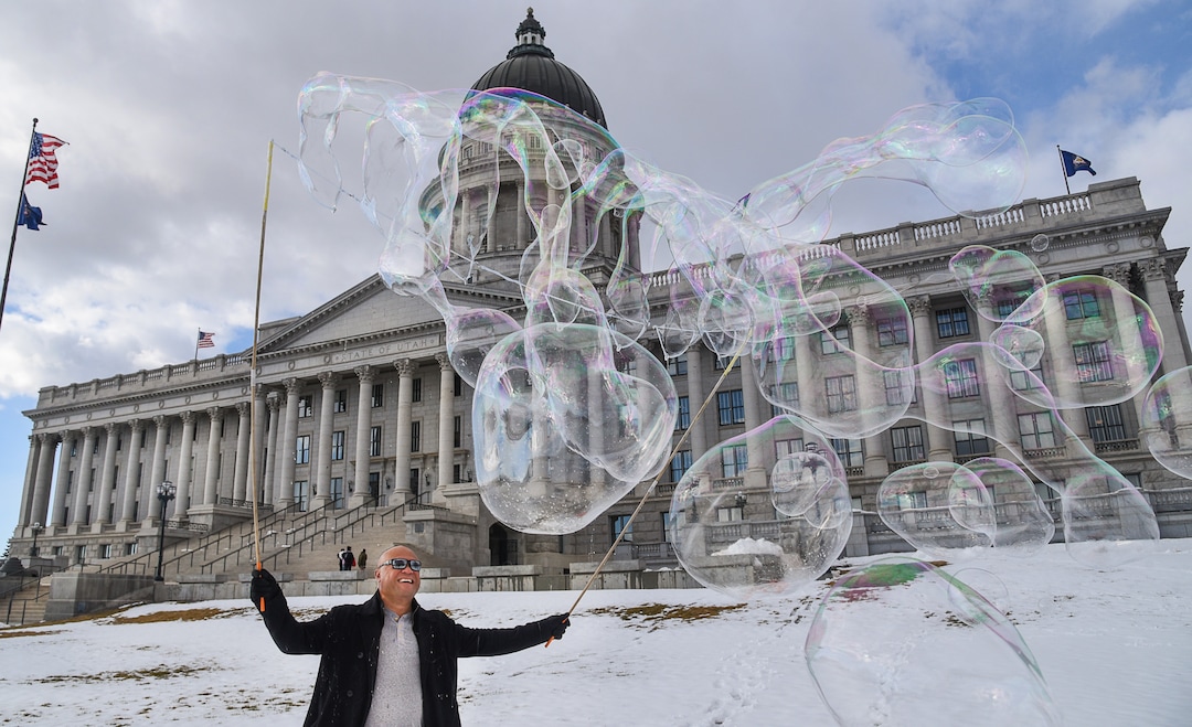 (Francisco Kjolseth  |  The Salt Lake Tribune)  Abraham Roe creates large soap bubbles on the front capitol of the Utah Capitol during the last day of the Legislative session on Thursday, March 14, 2019.