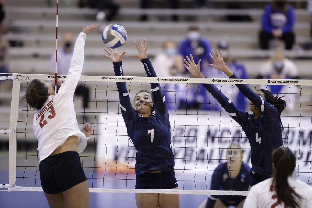 (Jaren Wilkey|BYU Photo) Wisconsin's Molly Haggerty, in white, gets a kill against BYU. The Badger hitter had a match-high 14 kills, while not making any errors.