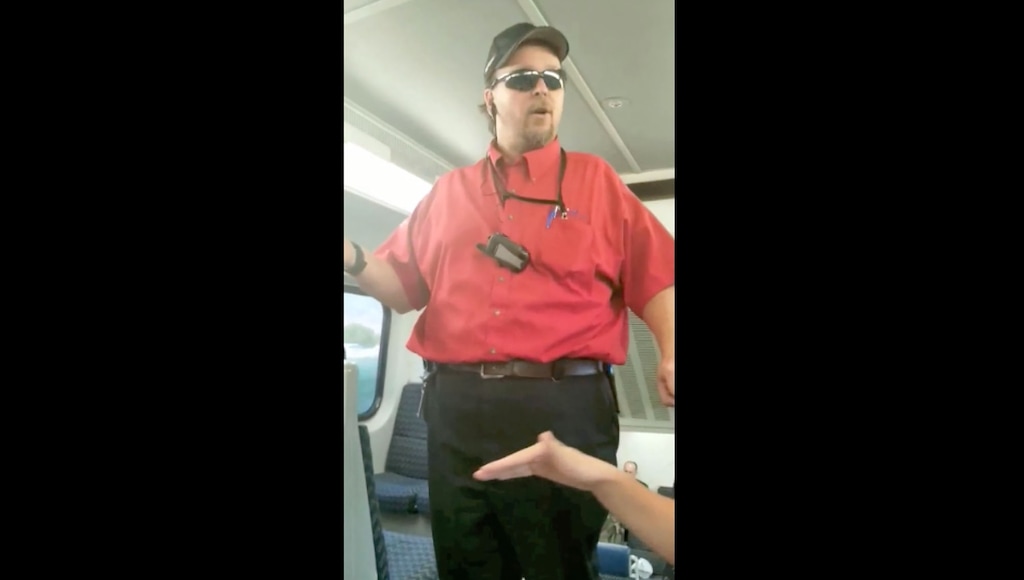 Image from a cellphone video shows a Utah Transit Authority employee confronting women on a FrontRunner train.