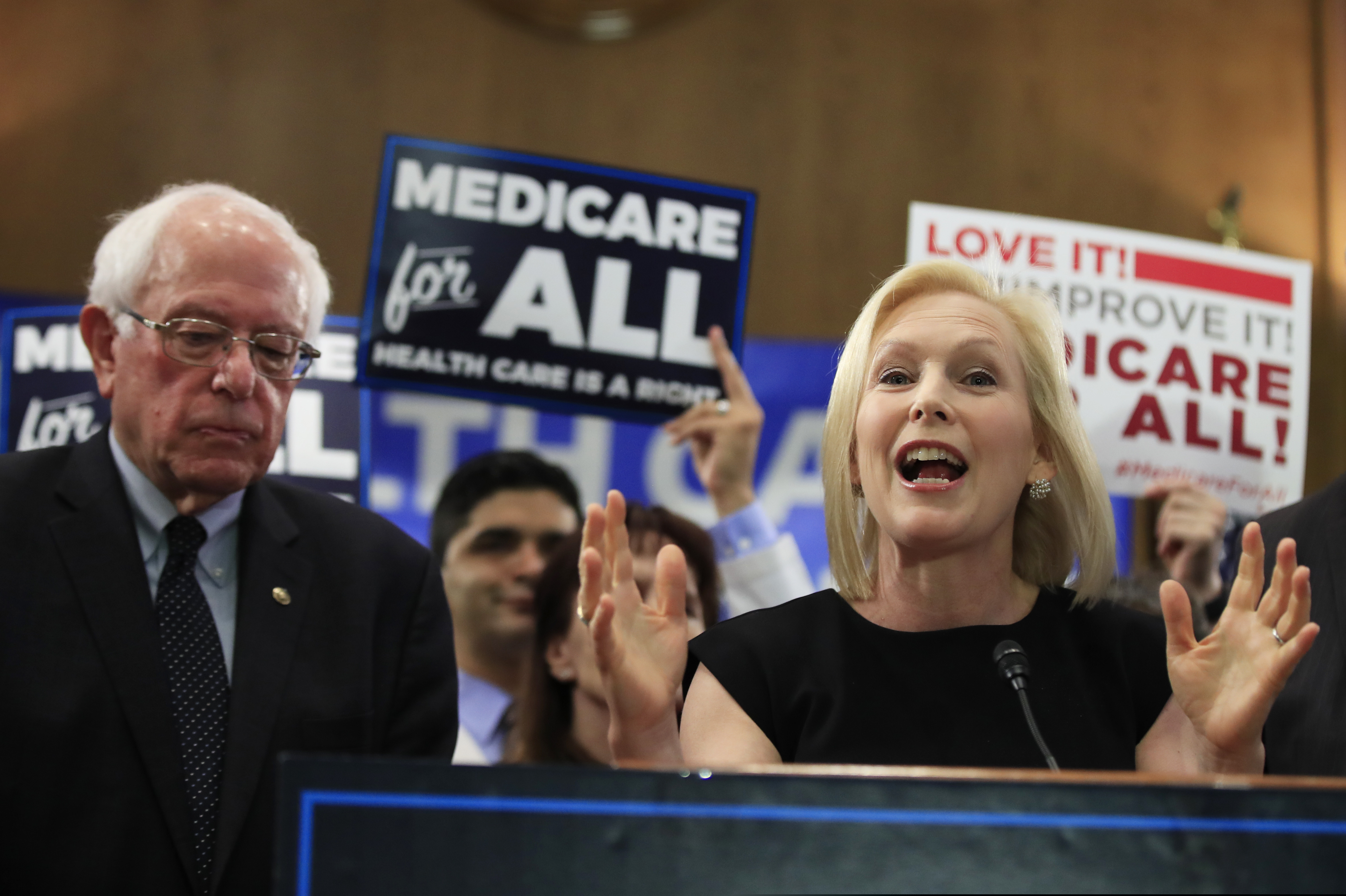 Sen. Kirsten Gillibrand, D-N.Y. with Sen. Bernie Sanders, I-Vt., speaks at a gathering introducing the Medicare for All Act of 2019, on Capitol Hill in Washington, Wednesday, April 10, 2019. (AP Photo/Manuel Balce Ceneta)