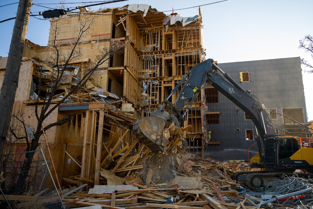 (Trent Nelson | The Salt Lake Tribune) Workers dismantle the five-story Union Walk apartment building on Ogden's 25th Street on Friday, Dec. 29, 2023.