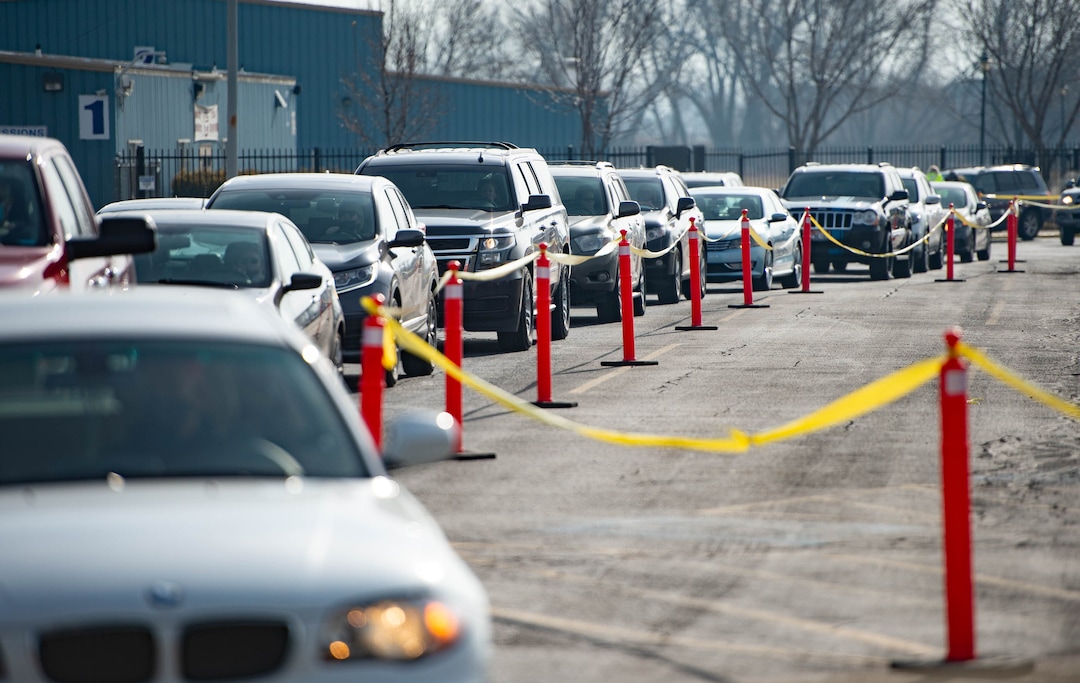 (Francisco Kjolseth  | The Salt Lake Tribune) Cars line up as the Davis County School District begins COVID-19 vaccinations for its teachers at the Davis County Legacy Center in Farmington on Tuesday, Jan. 12, 2021.