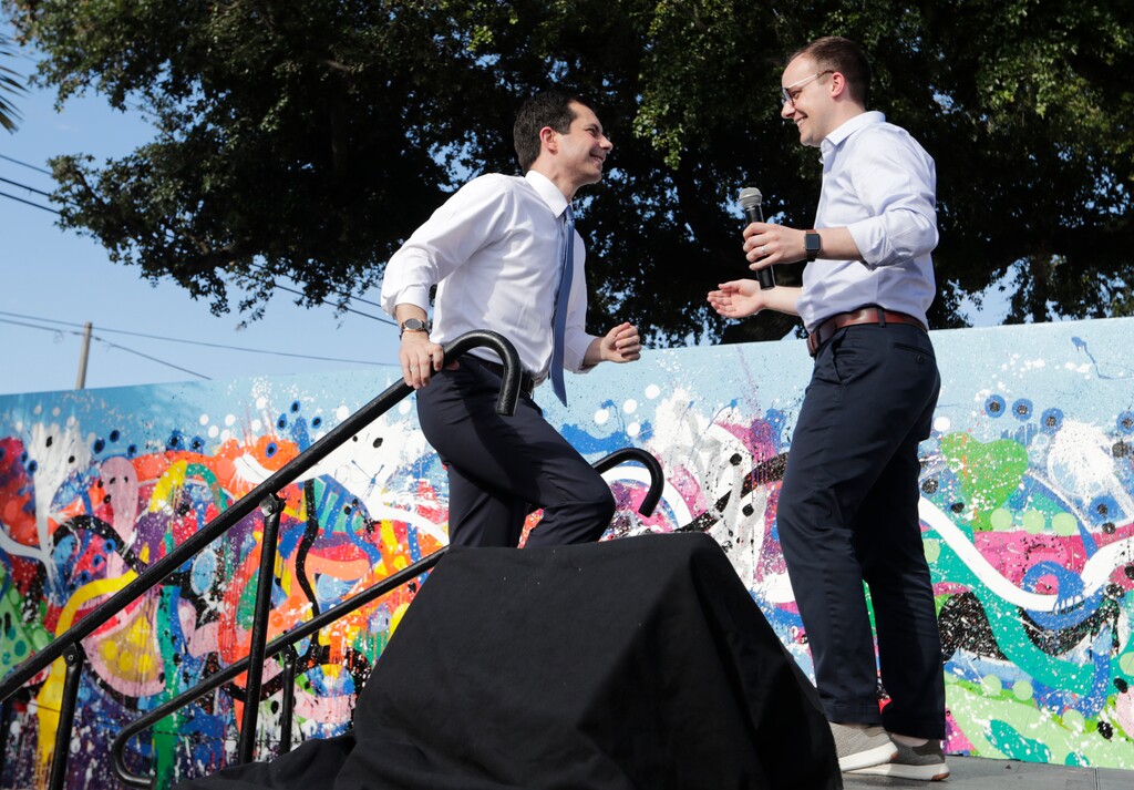 (Lynne Sladky | AP file photo) Democratic presidential candidate Pete Buttigieg, the mayor of South Bend, Ind., left, is introduced by his husband, Chasten Buttigieg, right, on May 20, 2019, during a fundraiser at the Wynwood Walls, in Miami.