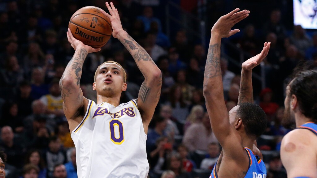 Los Angeles Lakers forward Kyle Kuzma (0) shoots in front of Oklahoma City Thunder guard Terrance Ferguson, center, in the first half of an NBA basketball game Saturday, Jan. 11, 2020, in Oklahoma City. (AP Photo/Sue Ogrocki)