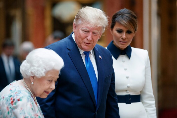 Britain's Queen Elizabeth II speaks to U.S President Donald Trump, centre and first lady Melania as they view U.S memorabilia from the Royal Collection, at Buckingham Palace, London, Monday, June 3, 2019. Trump is on a three-day state visit to Britain. (Tolga Akmen/Pool Photo via AP)