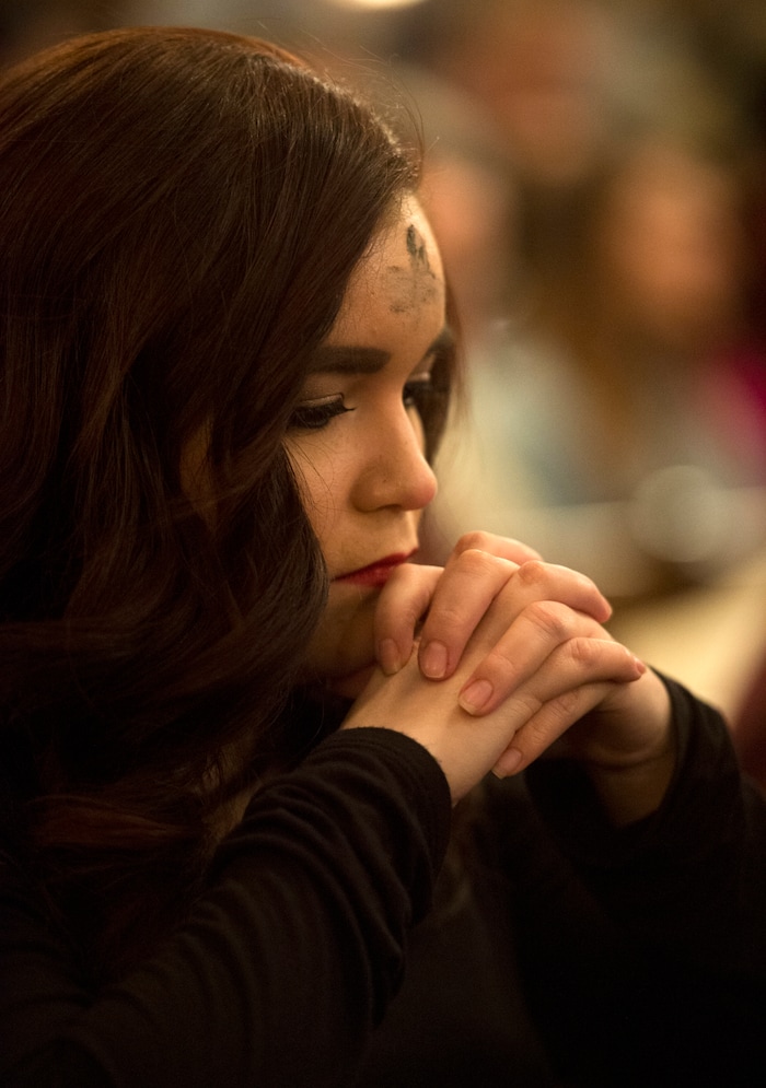 (Rick Egan | The Salt Lake Tribune) Victoria Moreno prays during the Ash Wednesday Mass, at the Cathedral of The Madeleine, Wednesday, Feb. 14, 2018.