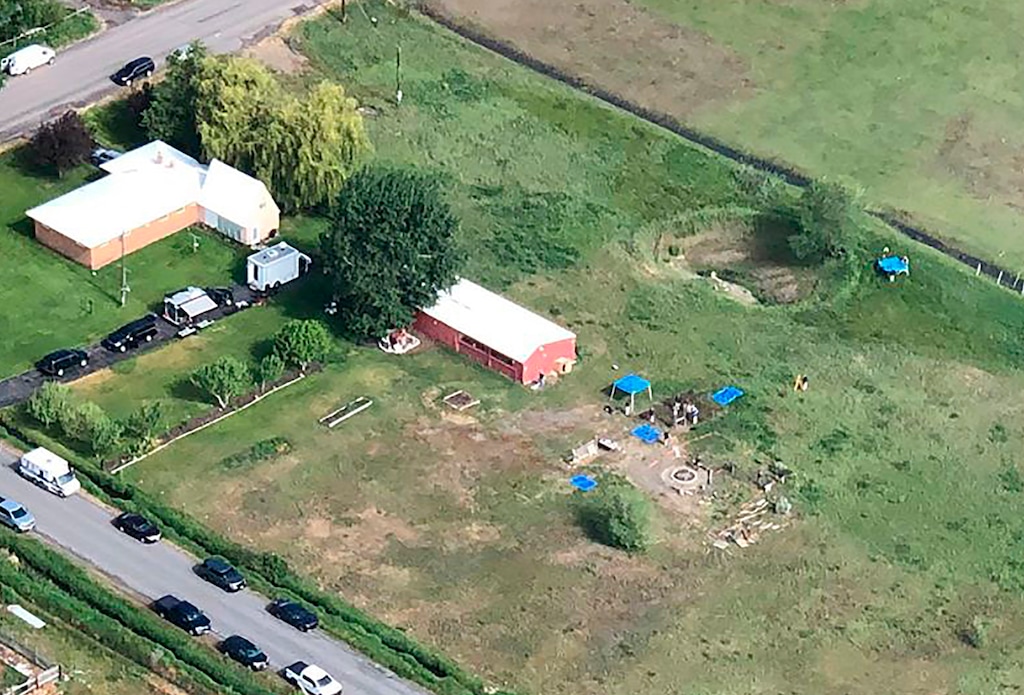 This aeriel photo provided by East Idaho News shows authorities investigating a home in Rexburg, Idaho on Tuesday June 9,2020. Authorities say they uncovered human remains at an Idaho man's home as they investigated the disappearance of his new wife's two children. The case has drawn global attention for its ties to the couple's doomsday beliefs and the mysterious deaths of their former spouses. Police in the small town say Chad Daybell was taken into custody. (Nate Eaton/EastIdahoNews.com via AP)