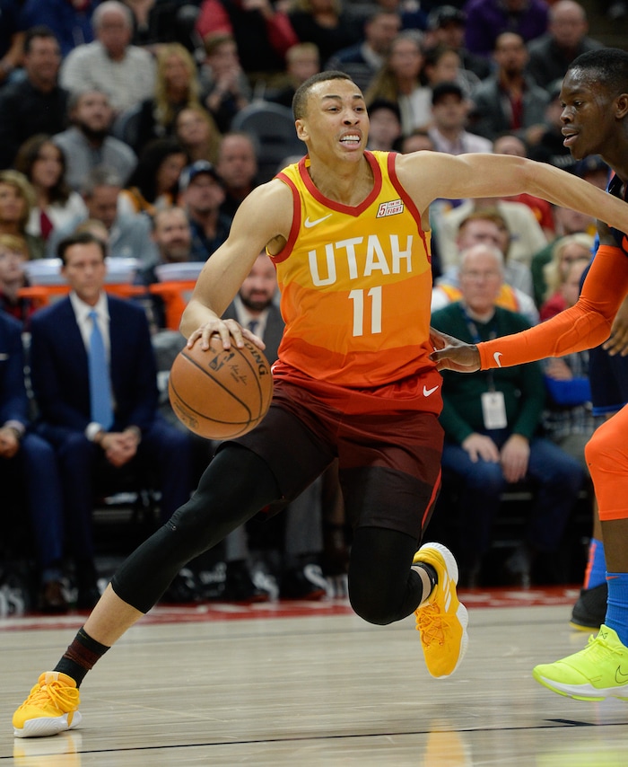 (Francisco Kjolseth  |  The Salt Lake Tribune)   Utah Jazz guard Dante Exum (11) tries to move past the Thunder defense in the NBA game at Vivint Smart Home Arena Sat., Dec. 22, 2018, in Salt Lake City.