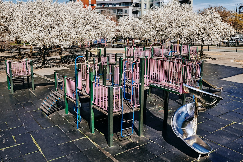 (Bryan Derballa | The New York Times) An empty playground in McCarren Park in Brooklyn on March 26, 2020. Children make up a very small proportion of American coronavirus cases so far and are significantly less likely to become seriously ill than American adults, according to a preliminary report on the first wave of coronavirus cases in the United States. But some have become very sick, and at least three have died.