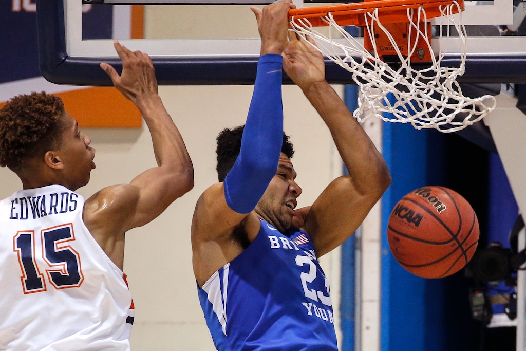 (Ringo H.W. Chiu | AP) BYU forward Yoeli Childs (23) dunks next to Pepperdine forward Kessler Edwards (15) during the first half of an NCAA college basketball game Saturday, Feb. 29, 2020, in Malibu, Calif.