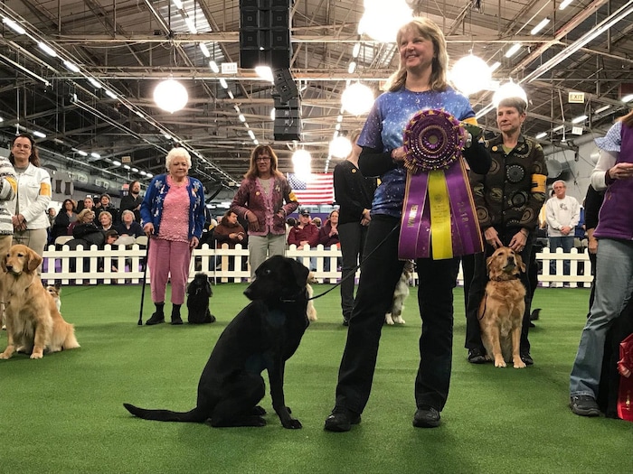 Linda Brennan and Heart pose for photos after winning the Westminster Masters Obedience Championship for the third time. (Karin Brulliard | The Washington Post)