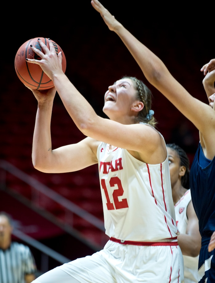 Lennie Mahler  |  The Salt Lake Tribune

Utah's Emily Potter drives to the basket in a game at the Huntsman Center in Salt Lake City, Saturday, Dec. 3, 2016.