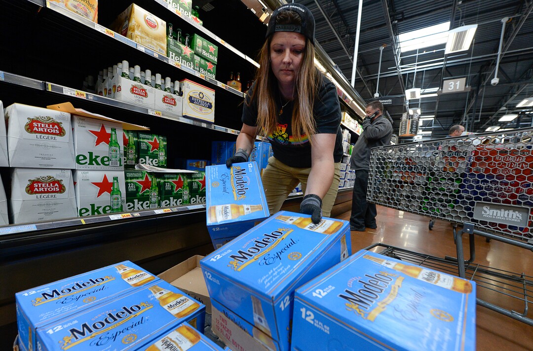 (Francisco Kjolseth  |  The Salt Lake Tribune)  Ashlin Trolin of Kiitos Brewery in Salt Lake City joins other distribution crews as they fill the shelves at Smith's Food and Drug in Woods Cross with beer that is 5% alcohol by volume on Friday, Nov. 1, 2019, for the first time in 86 years.