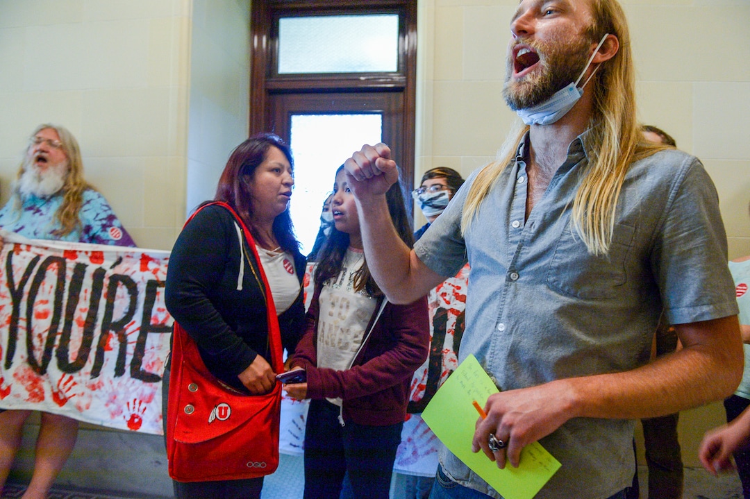 (Leah Hogsten  |  The Salt Lake Tribune) Opponents of the proposed inland port are escorted out of the Utah Inland Port Authority Board meeting by Utah Highway Patrol officers at the Capitol, June 5, 2019. The Inland Port Authority Board had to cancel its meeting last month after a group of protesters took over the meeting.