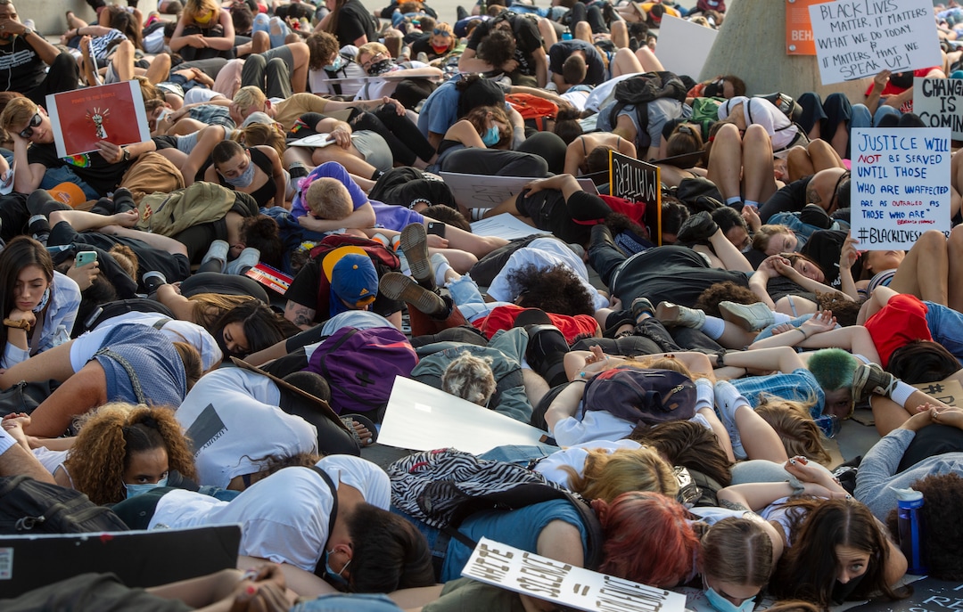 (Rick Egan  |  The Salt Lake Tribune)     Protesters lie down in silence for 9 minutes in memory of George Floyd, during a demonstration at the Public Safety Building, Wednesday, June 3, 2020.