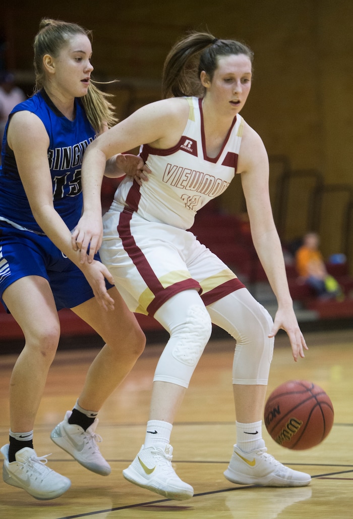 (Rick Egan  |  The Salt Lake Tribune)    Mercedes Staples (12) Viewmont, makes a move to the basket, as Maggie McCord (15) defends for Bingham, in prep basketball action, Bingham vs. Viewmont, in Bountiful, Wednesday, January 3, 2018.