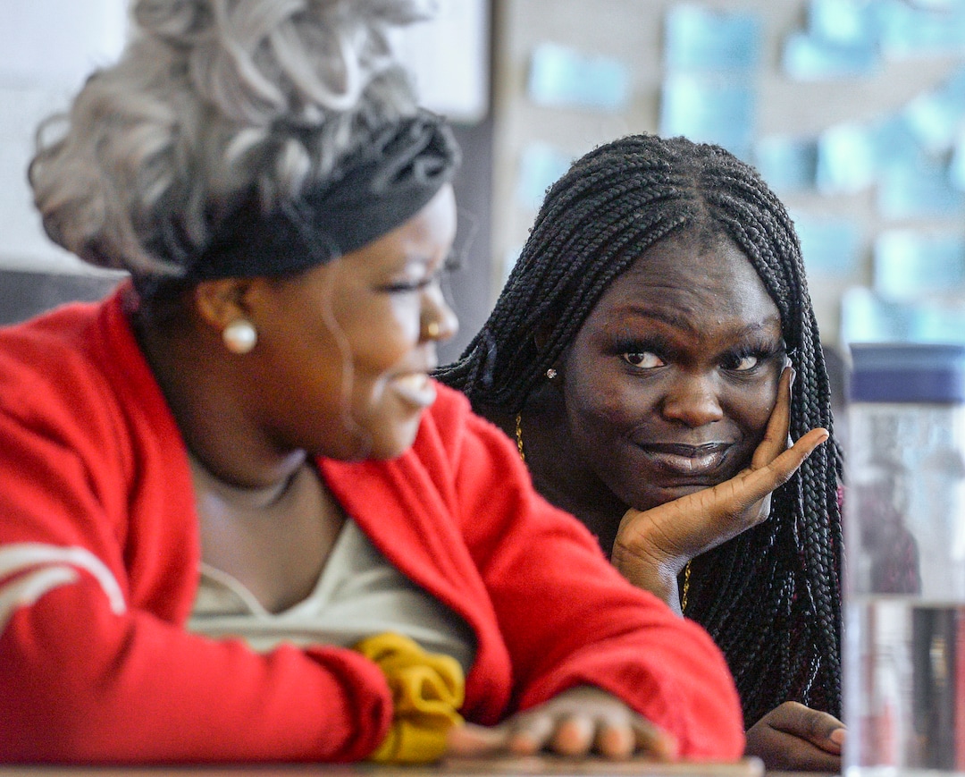 (Leah Hogsten  |  The Salt Lake Tribune) Ajak Shmir, right, reacts to the opinion of her friend Joyce Mayombe during East High School's Black Student Union meeting Sept. 18.