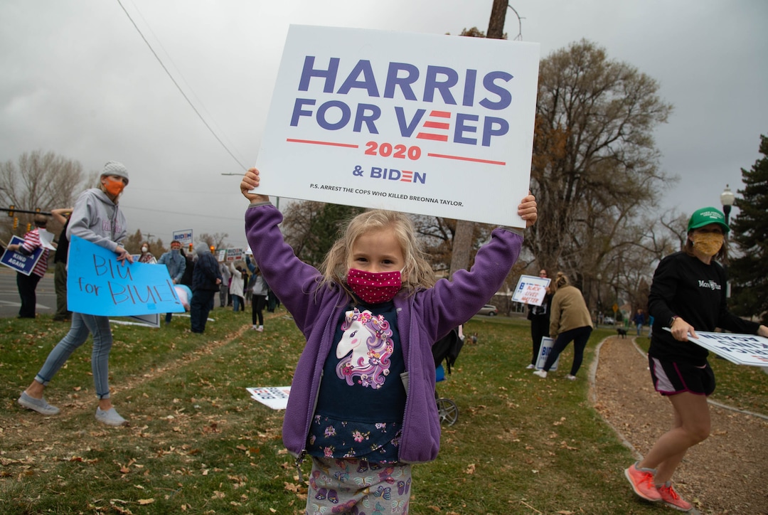 (Francisco Kjolseth  |  The Salt Lake Tribune) Petra Alward, 6, joins supporters of President-elect Joe Biden as they celebrate at Liberty Park on Saturday, Nov. 7, 2020, in Salt Lake City.