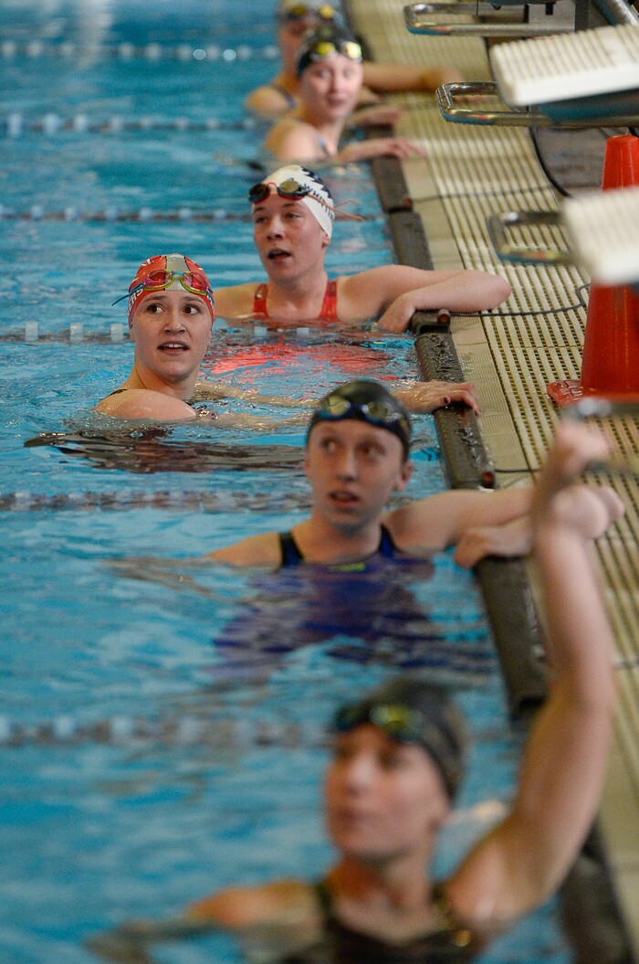 (Francisco Kjolseth  |  The Salt Lake Tribune)  Katie Hale of Park City, center left, checks her first place time in the Women 50 Yard Free at the high school swimming 4A State Championships in Bountiful, Friday February 9, 2018.