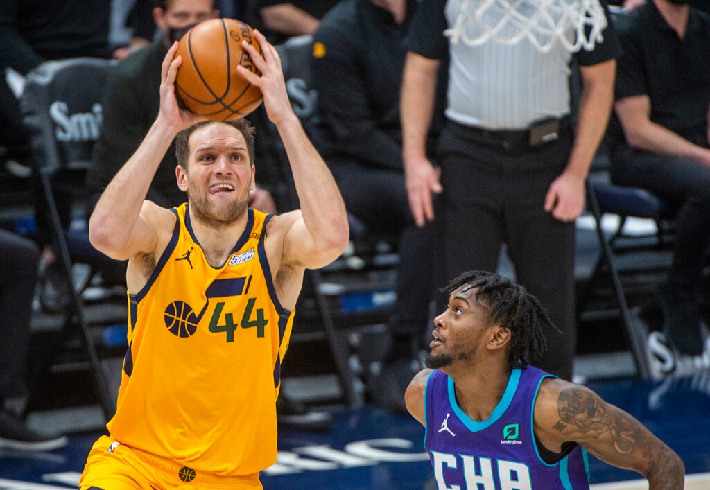 (Rick Egan | The Salt Lake Tribune) Utah Jazz forward Bojan Bogdanovic (44) shoots, as Charlotte Hornets forward Jalen McDaniels (6) defends, in NBA action between the Utah Jazz and the Charlotte Hornets at Vivint Arena, on Monday, Feb. 22, 2021.