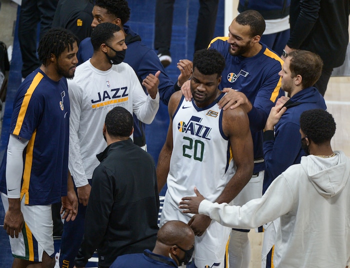 (Leah Hogsten | The Salt Lake Tribune) Utah Jazz center Udoka Azubuike (20) gets slaps from his teammates after getting charged with a flagrant-2 and ejected from the game for the contact with Phoenix Suns forward Abdel Nader (11) which caused him to hit his head on the court. The Jazz cracked open their 2020-21 preseason with their second game against the Phoenix Suns, Dec. 14, 2020.
