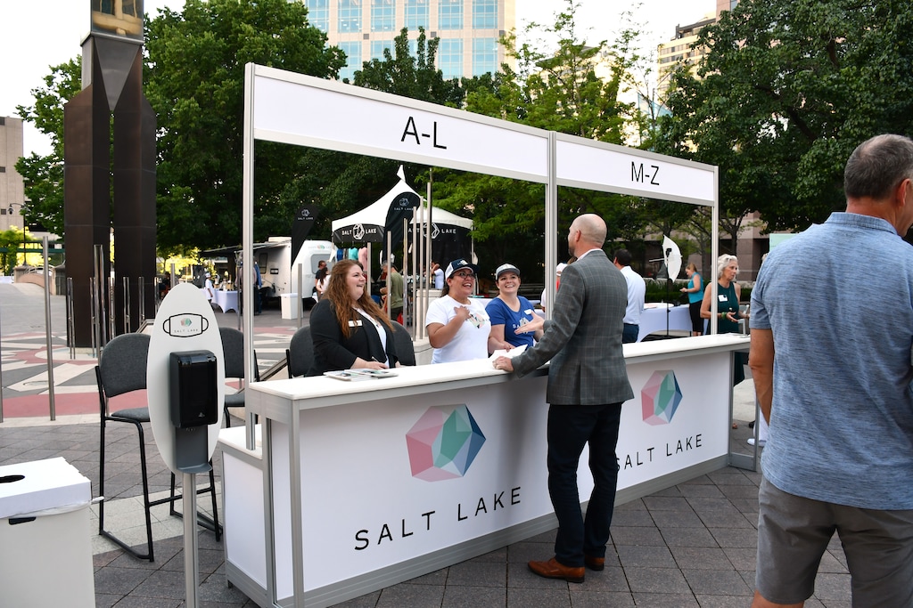 (Visit Salt Lake) | Visit Salt Lake volunteers welcome attendees at a client event.
