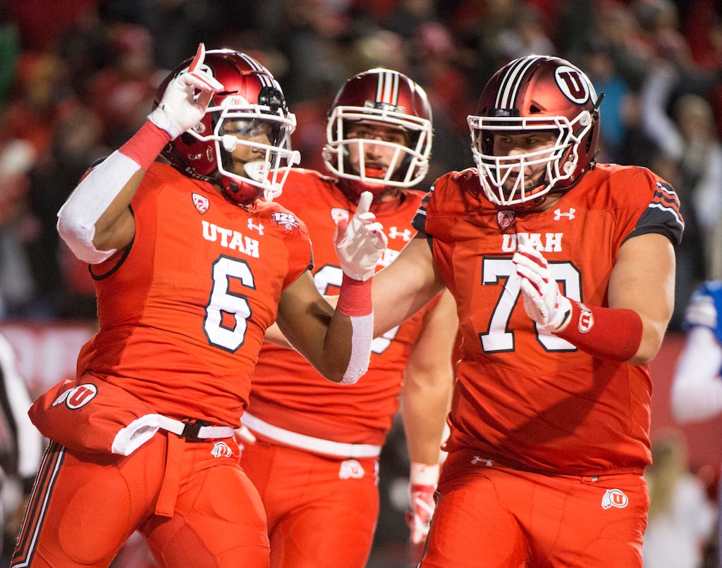 (Rick Egan  |  The Salt Lake Tribune)        Utah Utes running back Armand Shyne (6) celebrates with Utah Utes offensive lineman Jackson Barton (70), after scoring a touchdown late in the 4th quarter, tying the score at 27-27, in football action between the Brigham Young Cougars and the Utah Utes, at Rice-Eccles Stadium, Saturday, November 24, 2018.