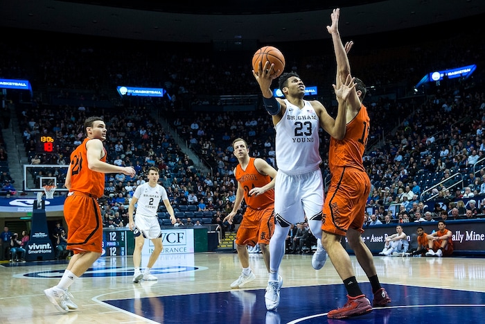 (Chris Detrick  |  The Salt Lake Tribune)  Brigham Young Cougars forward Yoeli Childs (23) shoots past Idaho State Bengals center Novak Topalovic (13) during the game at the Marriott Center Thursday, December 21, 2017.  