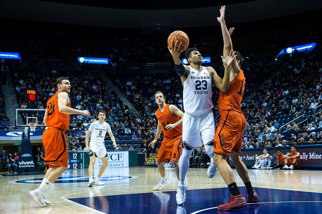 (Chris Detrick | The Salt Lake Tribune) Brigham Young Cougars forward Yoeli Childs (23) shoots past Idaho State Bengals center Novak Topalovic (13) during the game at the Marriott Center Thursday, December 21, 2017.