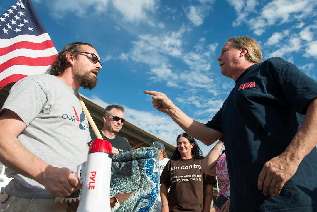 (Rick Egan  |  The Salt Lake Tribune)     Joshua  Cameron (left) argues with life-long gun owner Mark Stewart before a town hall meeting in Sandy, where survivors from the Florida school shooting held a forum with Utah students involved with the March for Our Lives movement, Saturday, July 14, 2018.
