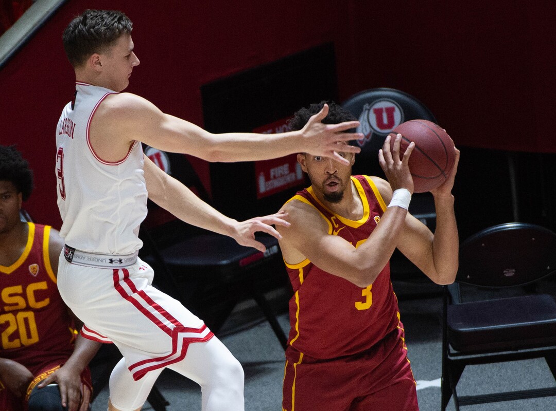 (Francisco Kjolseth  | The Salt Lake Tribune) Utah Utes guard Pelle Larsson (3) puts defensive pressure on USC Trojans forward Isaiah Mobley (3) in PAC-12 basketball action at the Jon M. Huntsman Center, on Saturday, Feb. 27, 2021.