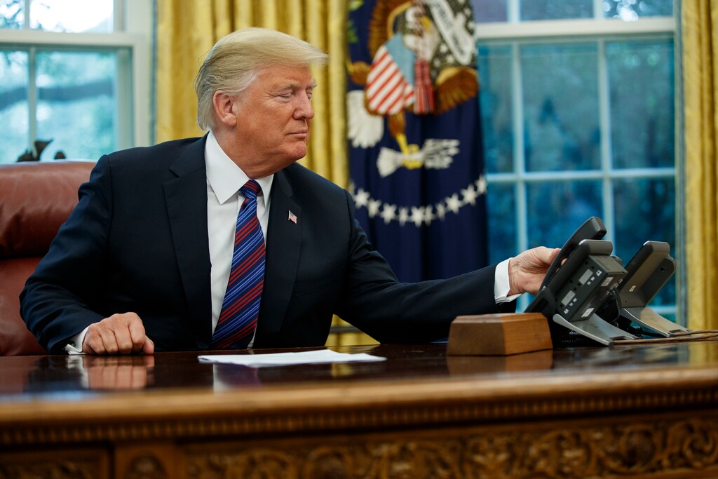 President Donald Trump hangs up the phone after talking with Mexican President Enrique Pena Nieto, in the Oval Office of the White House, Monday, Aug. 27, 2018, in Washington. Trump is announcing a trade "understanding" with Mexico that could lead to an overhaul of the North American Free Trade Agreement.
Trump made the announcement Monday in the Oval Office, with Mexican President Enrique Pena Nieto joining by speakerphone.  (AP Photo/Evan Vucci)