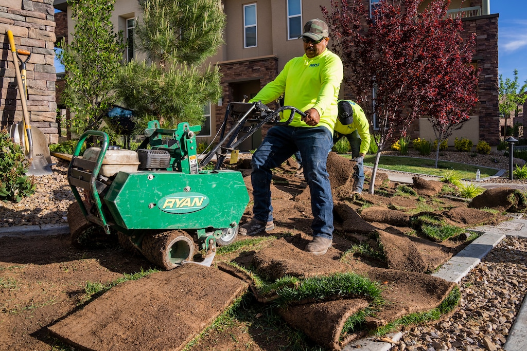 (Joe Buglewicz/The New York Times) Jaime Gonzalez removes non-functional turf from a residential development in Las Vegas, March 30, 2022. Under Assembly Bill 356, a Nevada state law passed last year that is the first of its kind in the nation, patches of "non-functional" grass that serve only an aesthetic purpose must be removed in favor of more desert-friendly landscaping.