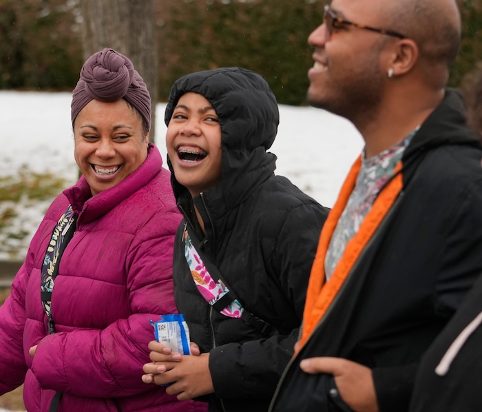(Leah Hogsten | The Salt Lake Tribune) Tiare Ete shares a laugh with her daugher Nakiah and brother DeSean Thomas during the march from East High School to Kingsbury Hall on Monday. To commemorate the legacy and work of Martin Luther King, Jr. and many other activists fighting for racial equality during the Civil Rights movement, the University of Utah's office of Equity, Diversity & Inclusion kicked off MLK Week 2023 with a rally at East High School, followed by a march to Kingsbury Hall, Jan. 16, 2023. 