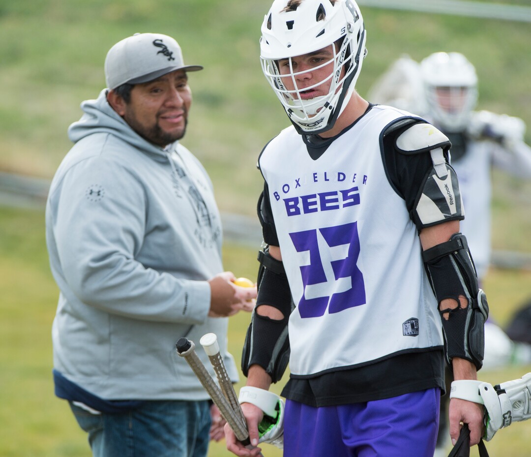 (Rick Egan | The Salt Lake Tribune) Box Elder lacrosse coach Juan Gaytan talks to player Logan Clark during a tournament in Logan on Saturday, Nov. 3, 2018.
