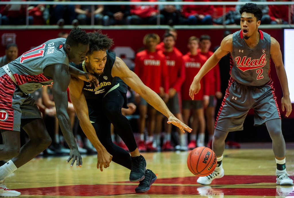 (Rick Egan  |  The Salt Lake Tribune)     Utah Utes forward Both Gach (11) tips the ball away from Colorado Buffaloes guard D'Shawn Schwartz (5), as Utah Utes guard Sedrick Barefield (2) looks on, in PAC-12 basketball action between the Utah Utes and the Colorado Buffaloes at the Jon M. Huntsman Center, Sunday, Jan. 20, 2019.