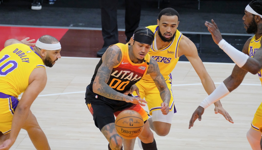 (Leah Hogsten | The Salt Lake Tribune) Utah Jazz guard Jordan Clarkson (00) slips past Los Angeles Lakers forward Jared Dudley (10), Los Angeles Lakers guard Talen Horton-Tucker (5) and Los Angeles Lakers center Montrezl Harrell (15) as the Utah Jazz take on the L.A. Lakers, Feb. 24, 2021 at Vivint Arena.