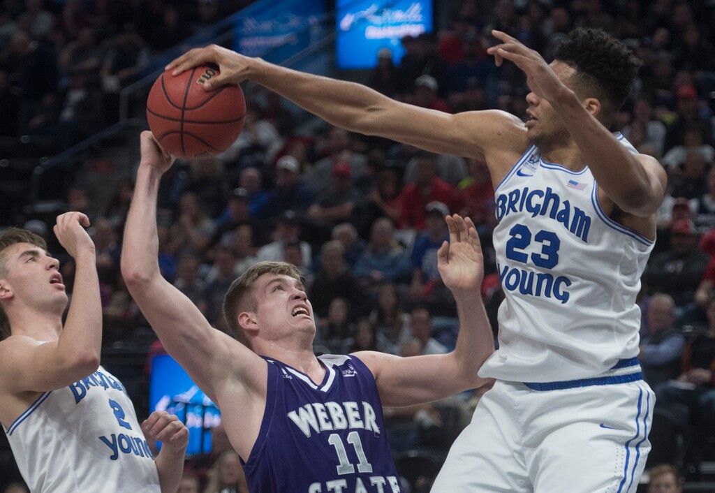 (Rick Egan  |  The Salt Lake Tribune)  Brigham Young Cougars forward Yoeli Childs (23) blocks a shot by Weber State Wildcats forward Michal Kozak (11), in Beehive Classic basketball action at the Vivint SmartHome Arena, Saturday, December 9, 2017.