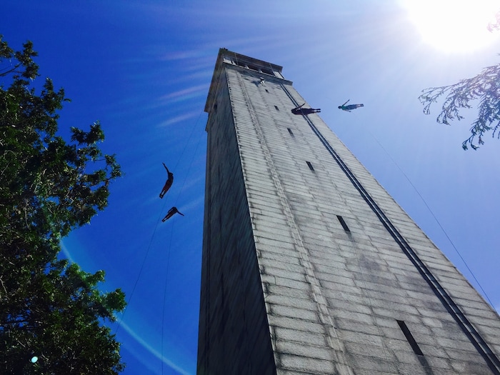 (Photo courtesy of Jessica Swanson) Oakland, Calif.-based “vertical dance” company BANDALOOP performs from the Sather Tower during Cal Day in Berkeley, Calif. BANDALOOP will be appearing at the Utah Arts Festival June 21-24, and will perform twice daily (5:30 and 7 p.m.) on the six-story library glass wall above the reflecting pool.
