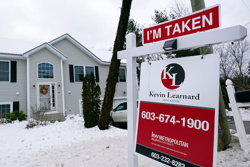(Charles Krupa | AP photo)

An "I'm Taken" placard rests on a real estate for sale sign outside a home, Dec. 10, 2020, in Manchester, N.H.