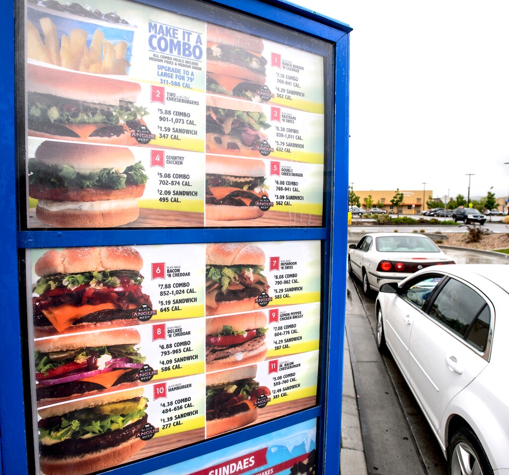 (Steve Griffin  |  The Salt Lake Tribune)  The menu at the Magna Arctic Circle includes calorie counts for all items.