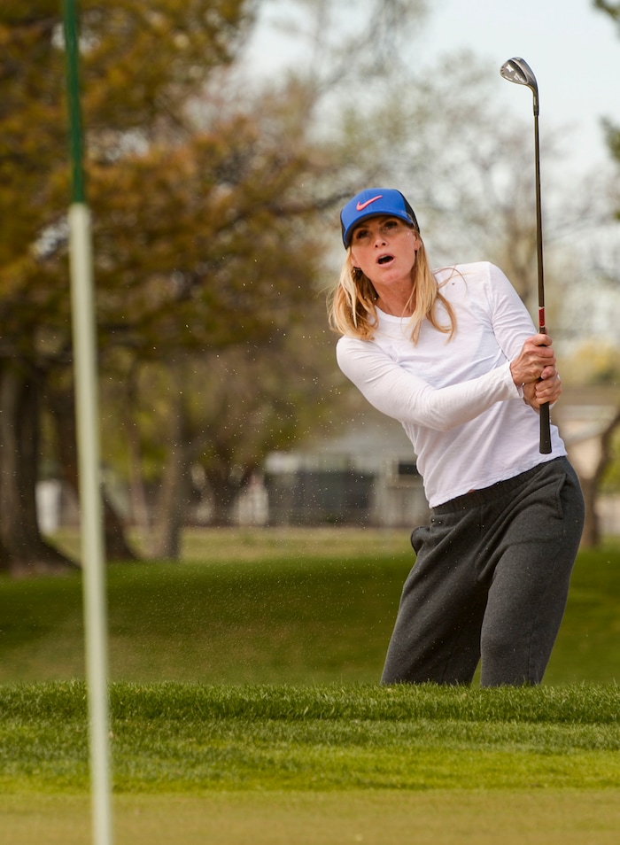 (Leah Hogsten | The Salt Lake Tribune) Brandie Grant fires out of a sand trap on Thursday while playing a round at Rose Park Golf Course April 9, 2020.