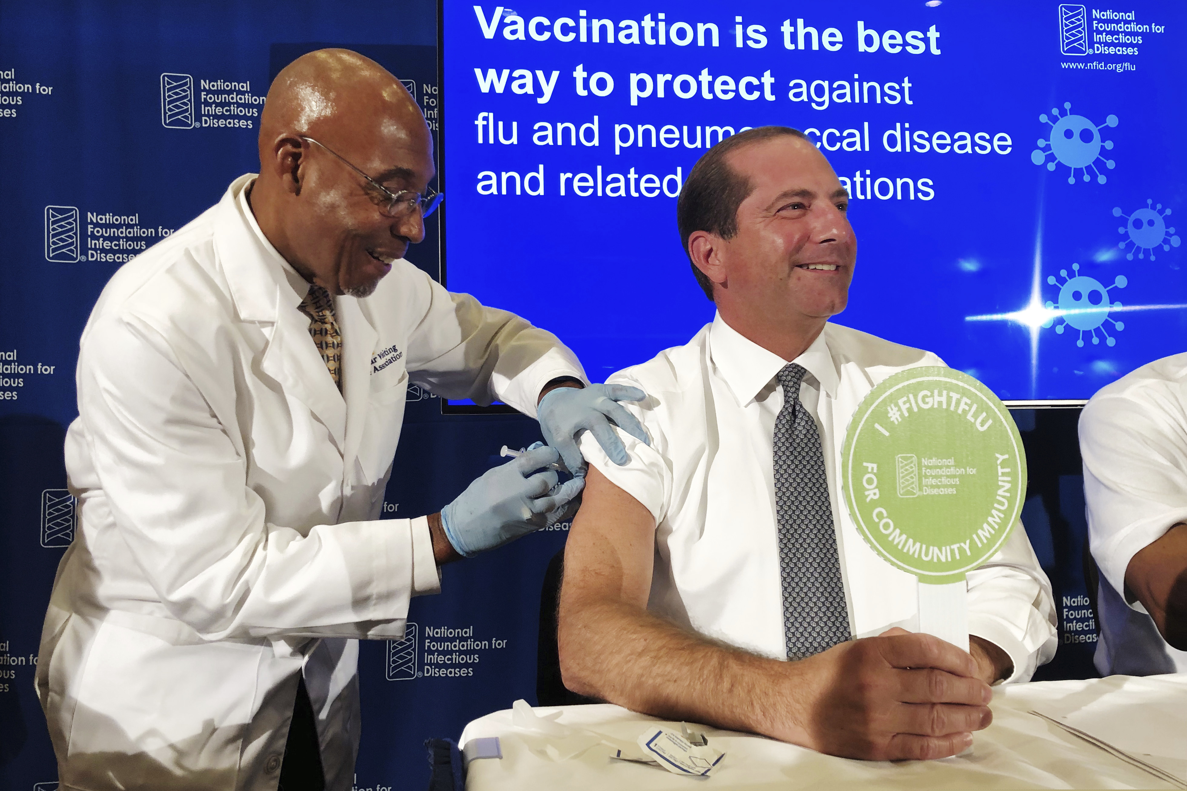 (Lauran Neergaard | AP file photo) B.K. Morris, a nurse with MedStar Visiting Nurses Association, gives a flu shot to Secretary of Health and Human Services Alex Azar during a news conference in Washington, Thursday, Sept. 26, 2019.