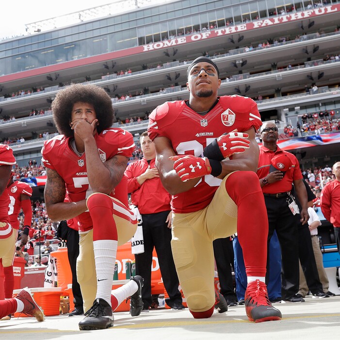 FILE - In this Oct. 2, 2016 file photo, San Francisco 49ers quarterback Colin Kaepernick, left, and safety Eric Reid kneel during the national anthem before an NFL football game against the Dallas Cowboys in Santa Clara, Calif.  As NFL training camps open, let's not forget two players who aren't suiting up. Kaepernick and Reid clearly are good enough to be playing, but the league has decided to make an example of them, a clear warning that only so much social activism will be tolerated.  (AP Photo/Marcio Jose Sanchez, File)