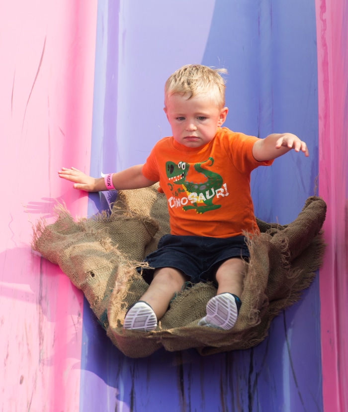 (Rick Egan  |  The Salt Lake Tribune)    Sawyer Jensen 5, rides down the Fun Slide, at the Davis County Fair in Farmington, Saturday, Aug. 18, 2018.