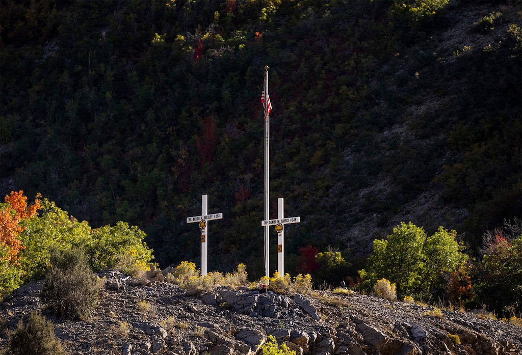 (Rick Egan | The Salt Lake Tribune)  Crosses on the hill south of I-80, near exit 131 in Parleys Canyon, on Wednesday, Sept. 27, 2023. An 18-year-old woman led Wasatch County Sheriff's officers to the location after telling them she had left her infant son's body there, according to a probable cause statement in the case. The woman is currently in jail without bond.