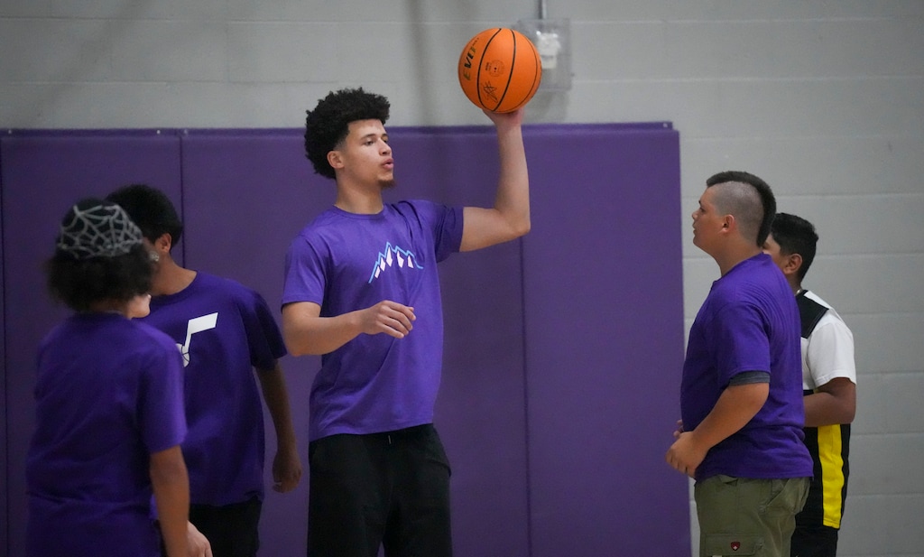 (Bethany Baker | The Salt Lake Tribune) Utah Jazz rookie Walter Clayton Jr. looks to pass the ball as he works with kids during a basketball clinic with new Utah Jazz rookies at the Boys and Girls Club of Greater Salt Lake in Murray on Tuesday, July 1, 2025.
