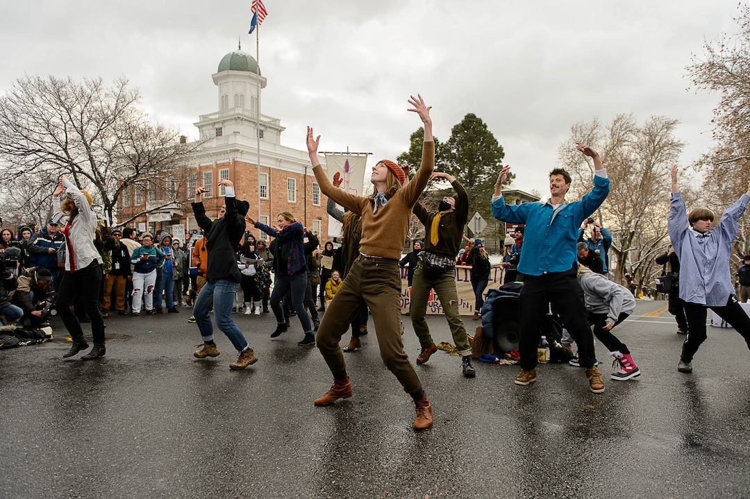 (Trent Nelson | The Salt Lake Tribune)  A dance group performs as protesters rally against a visit by President Donald Trump, Monday December 4, 2017.